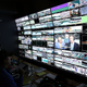 Production staff view screens in an ESPN operation room during the Wimbledon Lawn Tennis Championships at the All England Lawn Tennis and Croquet Club on July 8, 2015, in London. (Carl Court/Getty Images)